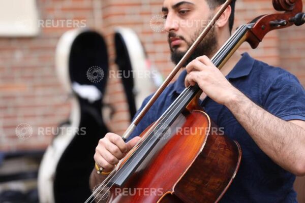 Musicians of Palestine youth orchestra meet on tour concert in Amsterdam A musician of Palestinian youth orchestra, who can't rehearse and play in their own land, plays his instrument at the Amsterdam Museum Netherlands August 14, 2019. REUTERS/Eva Plevier